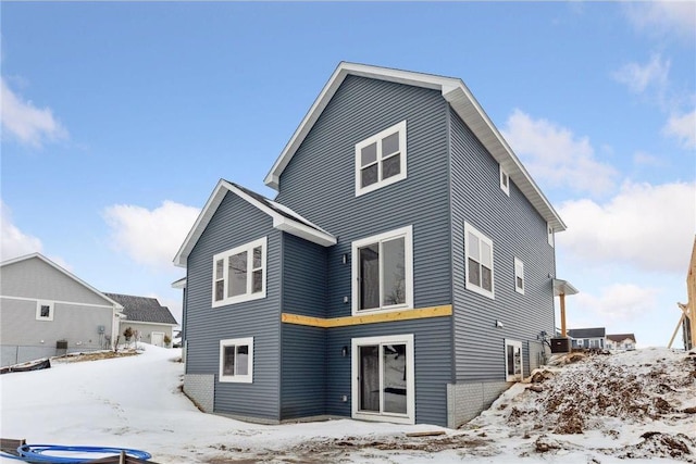 view of snow covered house