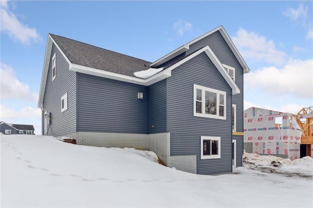 view of snow covered property