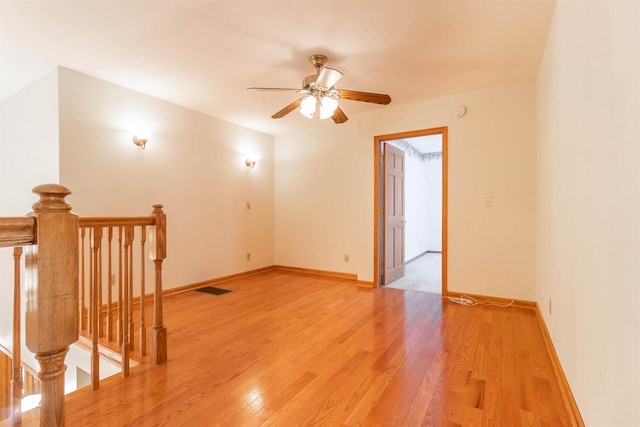 empty room featuring light hardwood / wood-style floors and ceiling fan