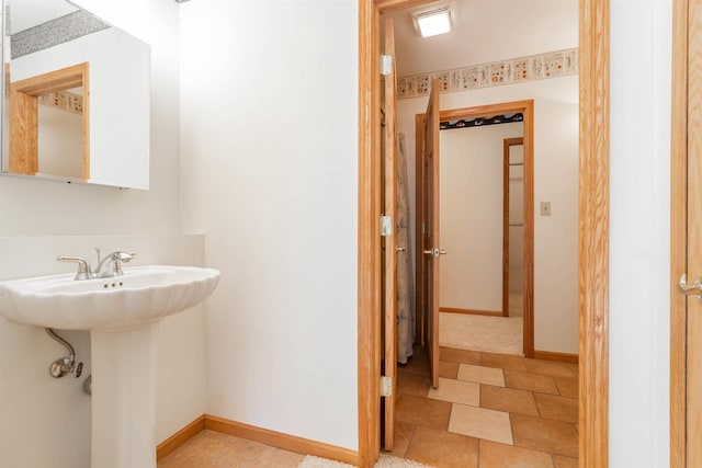 bathroom with tile flooring