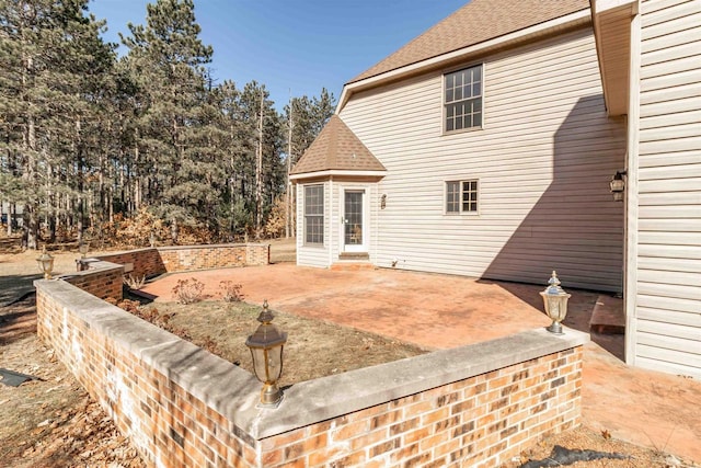 back of property featuring a patio area