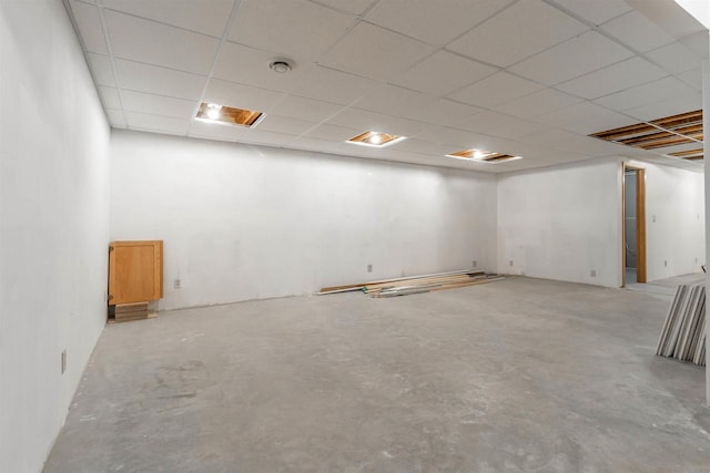 basement featuring a paneled ceiling