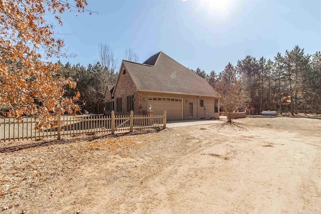 view of home's exterior with a garage