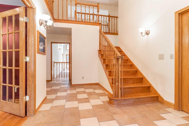 stairway featuring light tile flooring