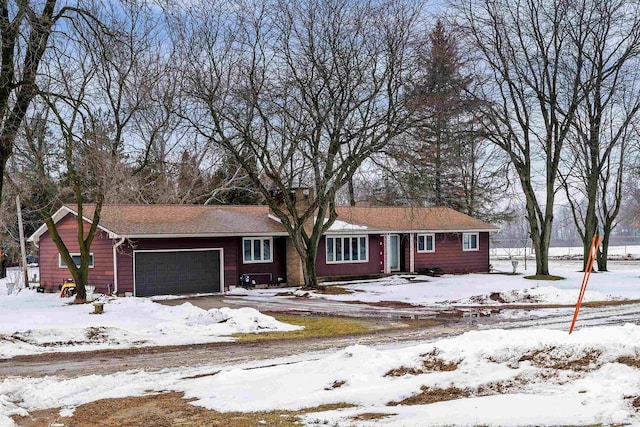 single story home with a garage