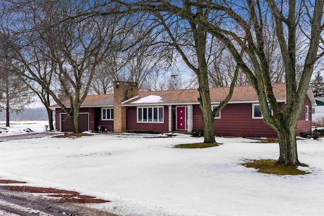 ranch-style home featuring a garage