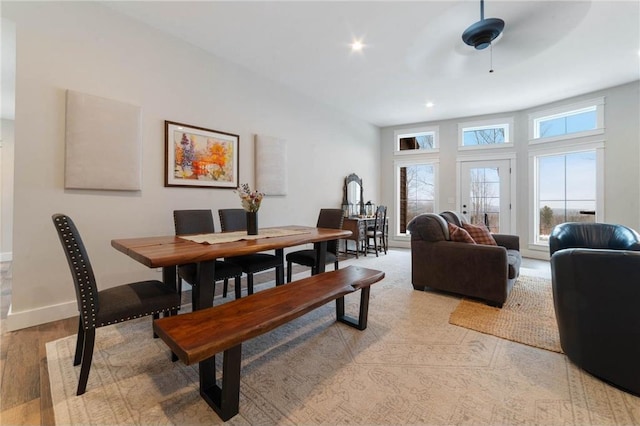 dining area featuring ceiling fan and light wood-type flooring