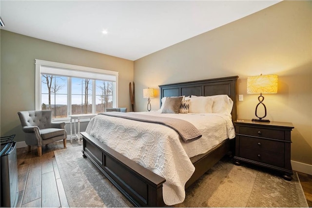 bedroom with hardwood / wood-style floors