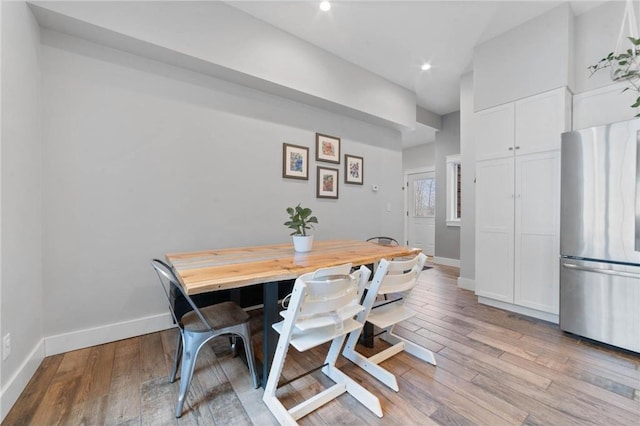 dining space featuring light wood-type flooring