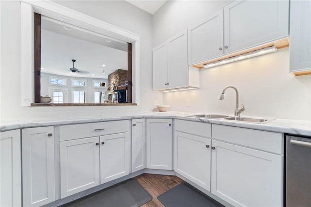 kitchen featuring white cabinets, dark hardwood / wood-style floors, and dishwasher