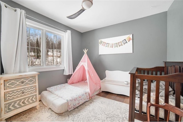 bedroom featuring ceiling fan and hardwood / wood-style flooring