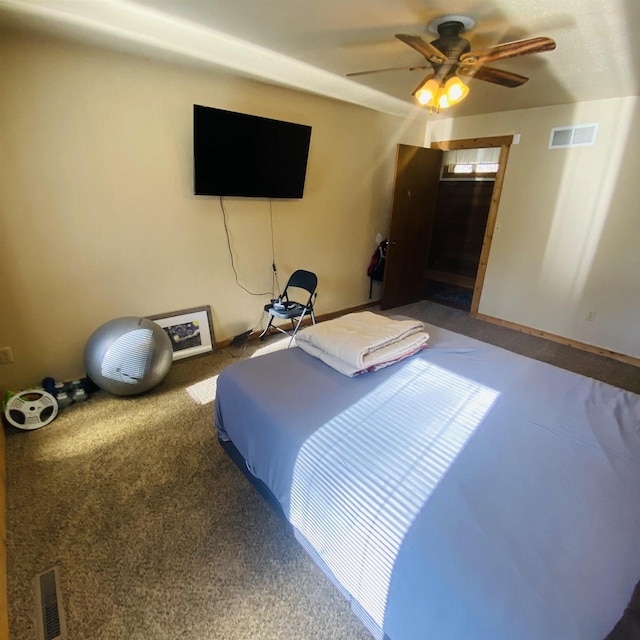 carpeted bedroom with ceiling fan