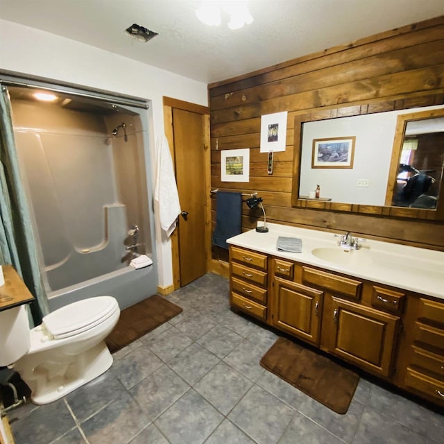 full bathroom featuring wood walls, shower / bath combination, toilet, vanity, and tile floors