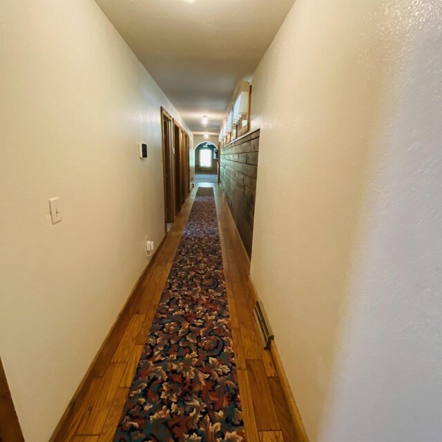 corridor featuring hardwood / wood-style floors