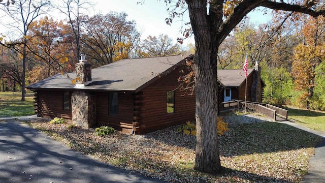 view of side of property featuring a yard