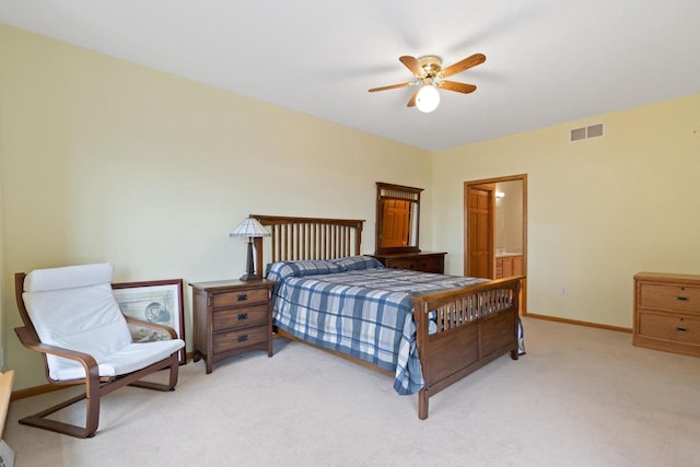 bedroom featuring ceiling fan, connected bathroom, and light colored carpet