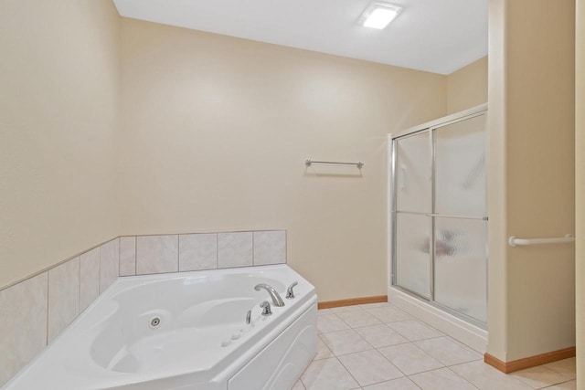 bathroom with tile flooring and plus walk in shower