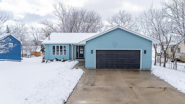 single story home with a garage