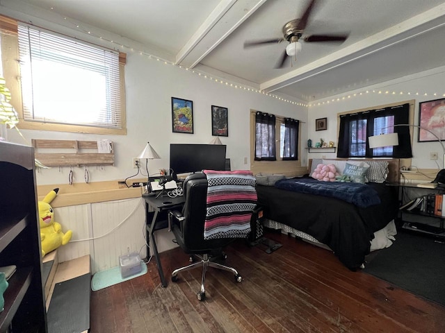 bedroom with hardwood / wood-style flooring and beamed ceiling