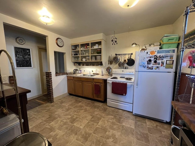 kitchen featuring sink and white appliances