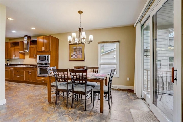 tiled dining area featuring an inviting chandelier