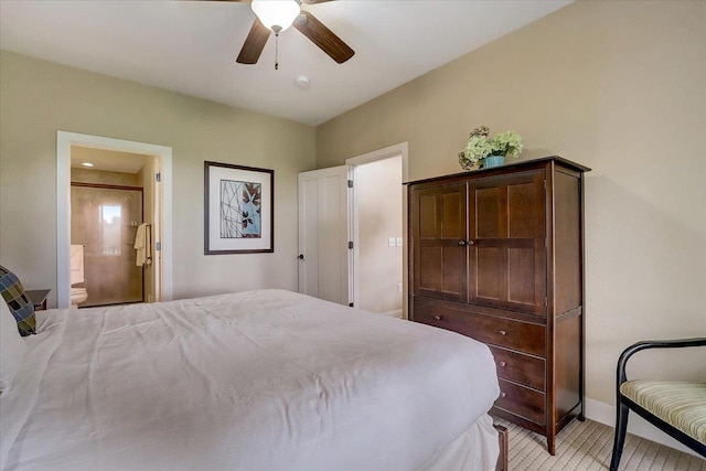 bedroom featuring ceiling fan and ensuite bathroom