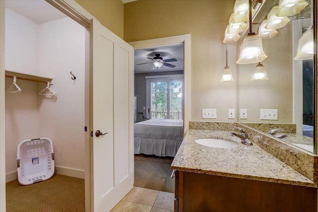 bathroom with tile floors, oversized vanity, and ceiling fan