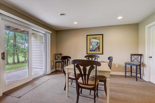 view of carpeted dining area