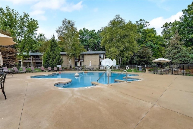 view of swimming pool featuring a patio area