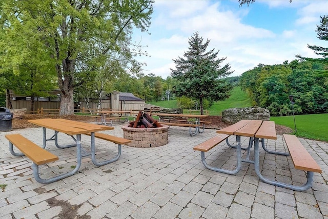 view of patio / terrace with a fire pit