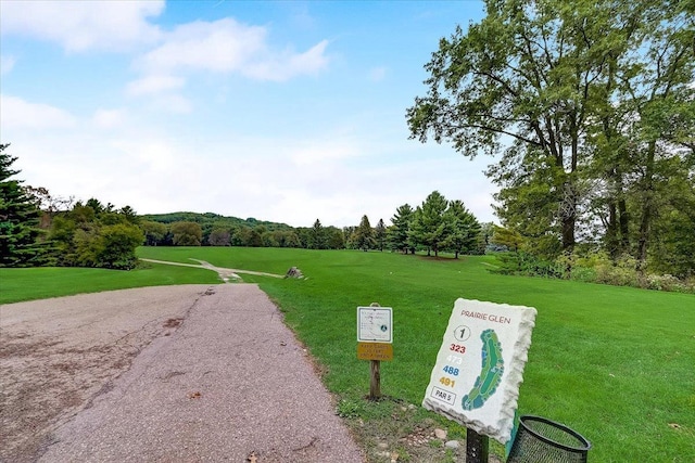 view of property's community with a lawn