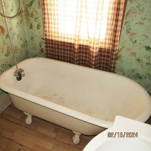 bathroom with wood-type flooring