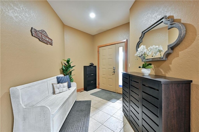 entrance foyer featuring light tile flooring