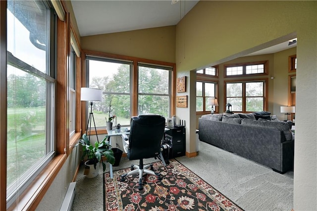 office space featuring light colored carpet and vaulted ceiling