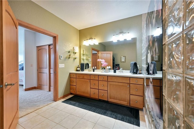 bathroom featuring dual vanity and tile floors