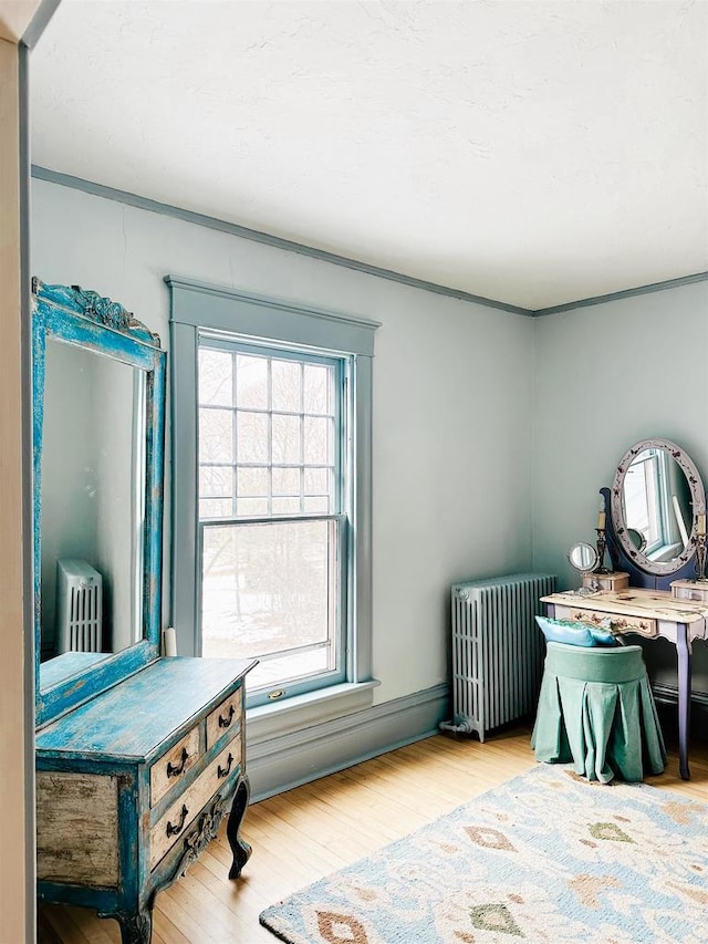 interior space featuring light hardwood / wood-style floors and radiator heating unit