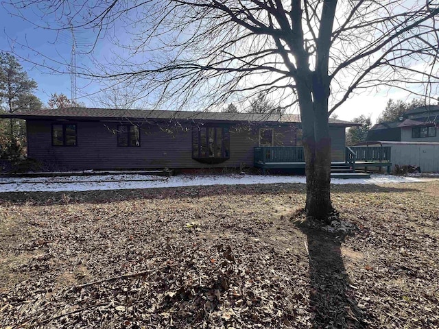 view of front of property with a deck