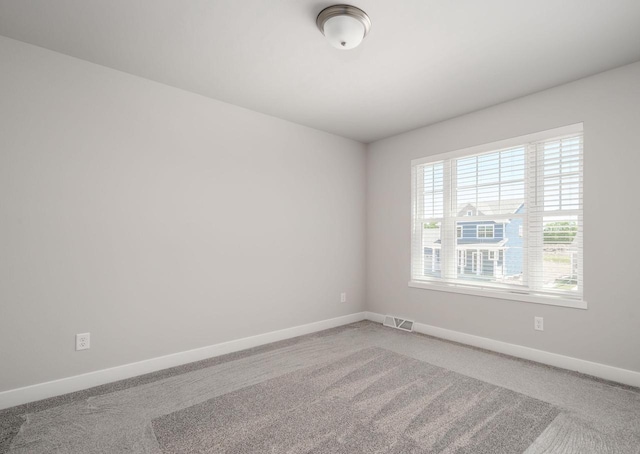 unfurnished room featuring carpet floors