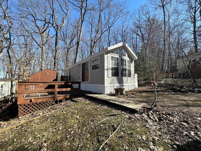 view of home's exterior with a deck