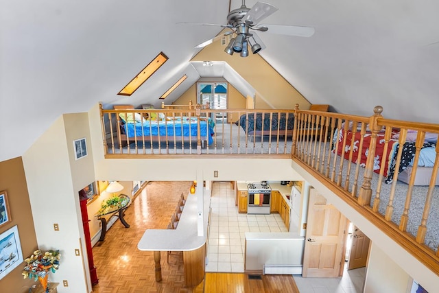W1188 Spring Grove Rd, Green Lake, WI 54971 - interior space with vaulted ceiling with skylight and ceiling fan
