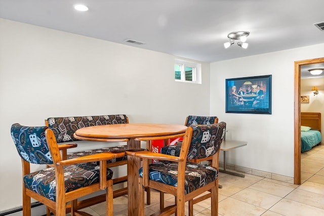W1188 Spring Grove Rd, Green Lake, WI 54971 - tiled dining room with a baseboard radiator