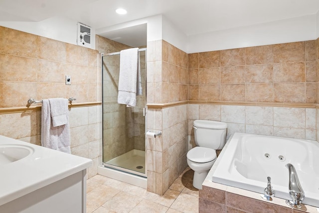 W1188 Spring Grove Rd, Green Lake, WI 54971 - full bathroom featuring tile walls, toilet, plus walk in shower, tile floors, and vanity