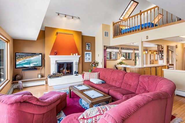 W1188 Spring Grove Rd, Green Lake, WI 54971 - living room featuring plenty of natural light, wood-type flooring, and track lighting