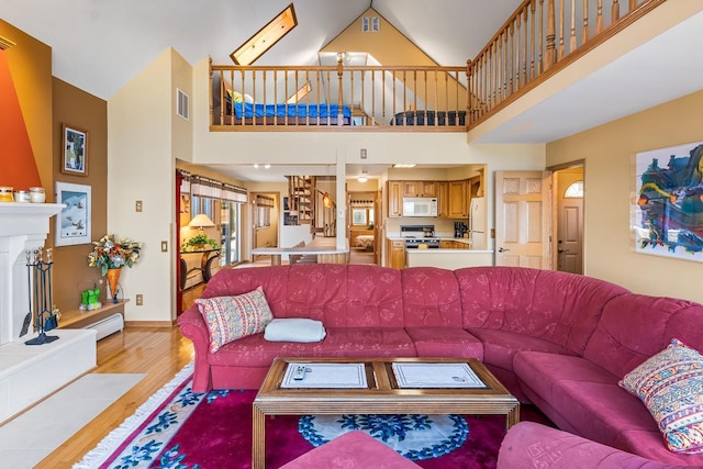 W1188 Spring Grove Rd, Green Lake, WI 54971 - living room with light hardwood / wood-style flooring and a high ceiling