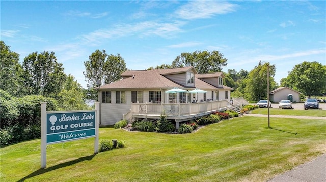 exterior space with a front yard and a wooden deck