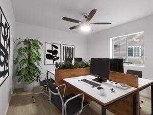 office area with ceiling fan and hardwood / wood-style floors