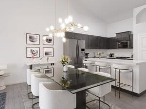 dining space with a notable chandelier and light wood-type flooring