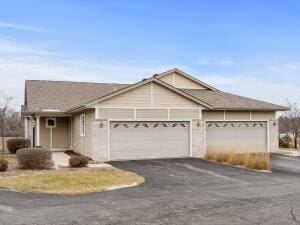 single story home featuring a garage