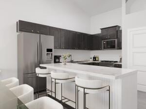 kitchen featuring stainless steel fridge with ice dispenser, a kitchen breakfast bar, a kitchen island, and range