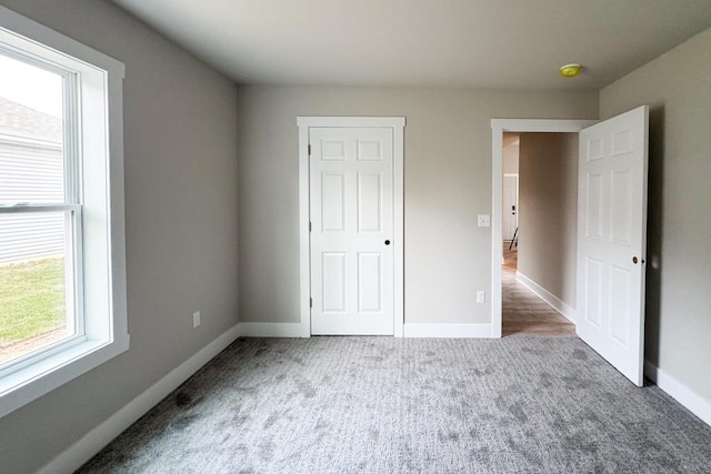 unfurnished bedroom featuring carpet